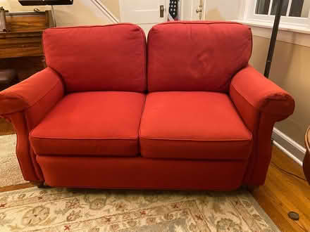 Photo of free Red loveseat (Demarest) #1