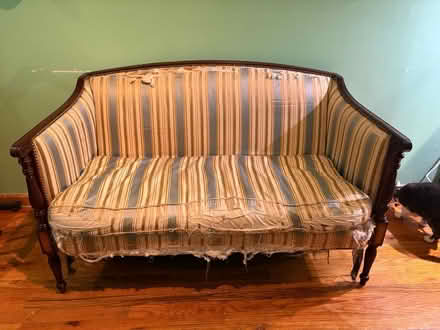 Photo of free Loveseat needs reupholstering (Bushwick) #1