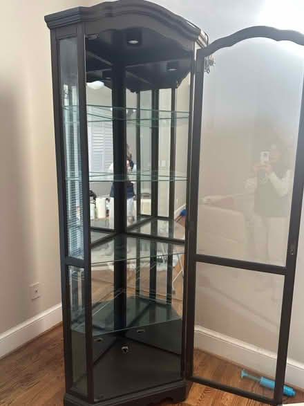 Photo of free Espresso color corner cabinet (2700 S Joyce st. Arlington VA) #1