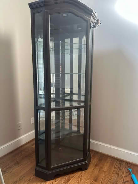 Photo of free Espresso color corner cabinet (2700 S Joyce st. Arlington VA) #2