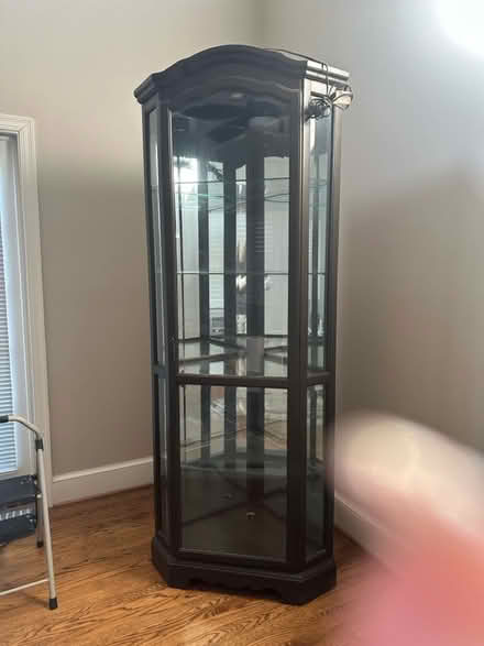 Photo of free Espresso color corner cabinet (2700 S Joyce st. Arlington VA) #3