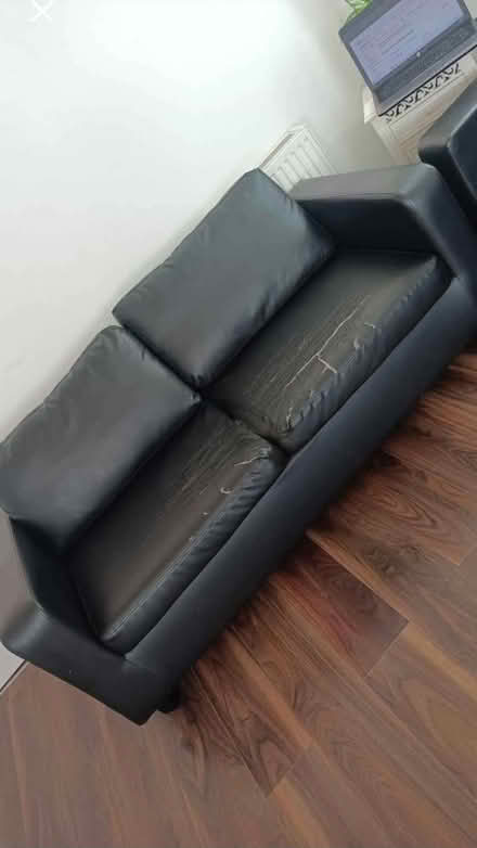 Photo of free Three seater black leather look sofa (Nitshill G53) #1