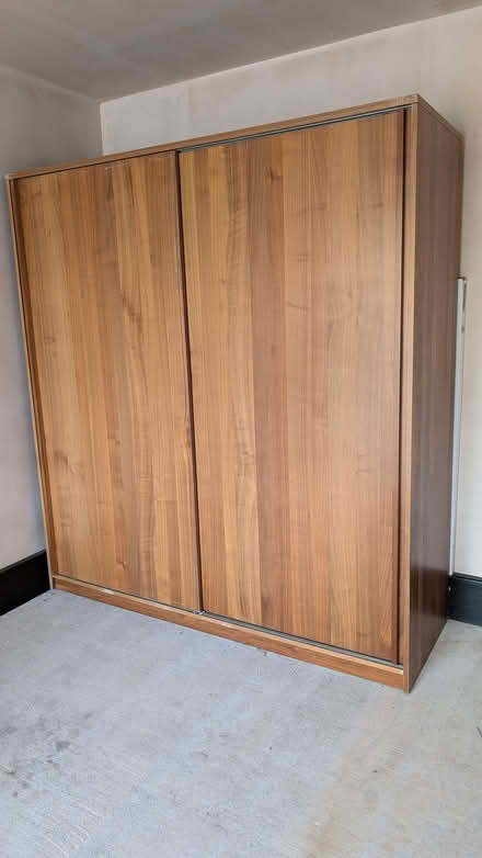 Photo of free Two doors brown wood wardrobe (H195cm, W180cm, D60cm) Attenborough (Long Lane Recreation Ground NG9) #1