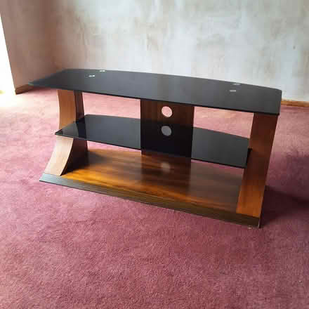 Photo of free Black glass and dark wood tv stand (Bedlington Station, NE22) #1