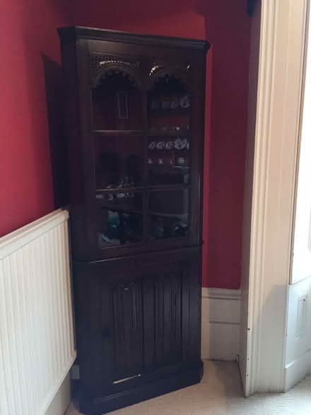 Photo of free Tall glass-fronted dark wood cabinet (Park Central B15) #3