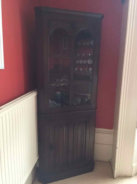 Photo of free Tall glass-fronted dark wood cabinet (Park Central B15) #2