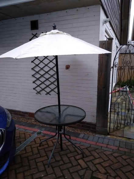 Photo of free Outdoor table with patio umbrella (YO24) #1