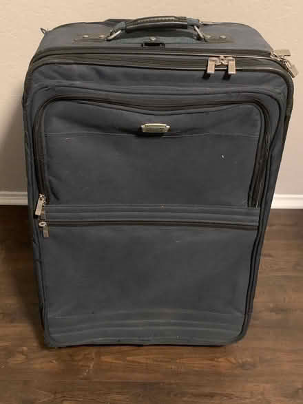 Photo of free Large navy blue suitcase (Near Treat and Oak Grove) #1