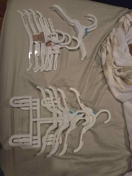 Photo of free Plastic baby clothes hangers (Cleveland St & Washington Ave.) #1