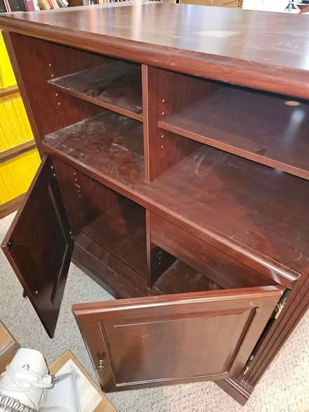 Photo of free Wood entertainment cabinet (Beavercreek) #1