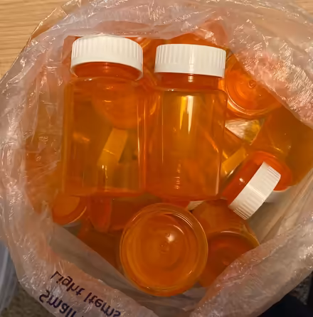 Photo of free About 2 dozen used medicine bottles (Fremont, Seattle) #1