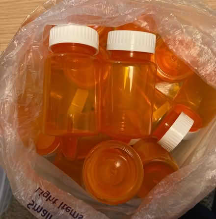Photo of free About 2 dozen used medicine bottles (Fremont, Seattle) #1