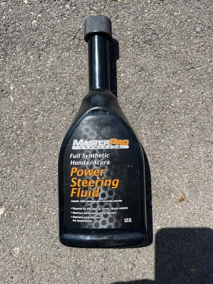Photo of free 1/2 full Power steering fluid (Grove Rd and Harris) #1