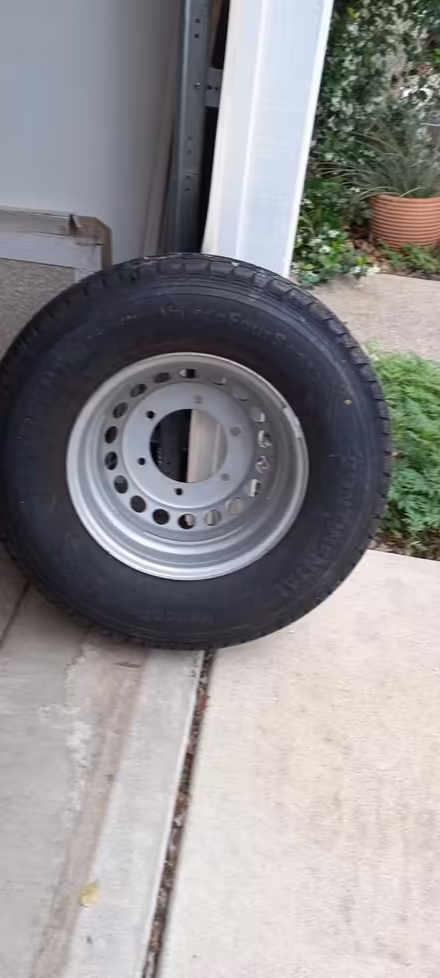 Photo of free Large heavy-duty wheel with tire (East Austin near the airport) #1