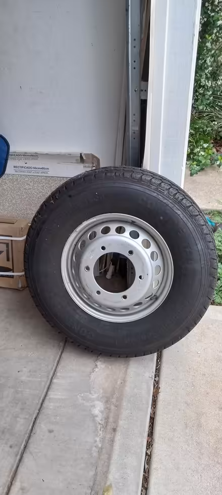 Photo of free Large heavy-duty wheel with tire (East Austin near the airport) #2