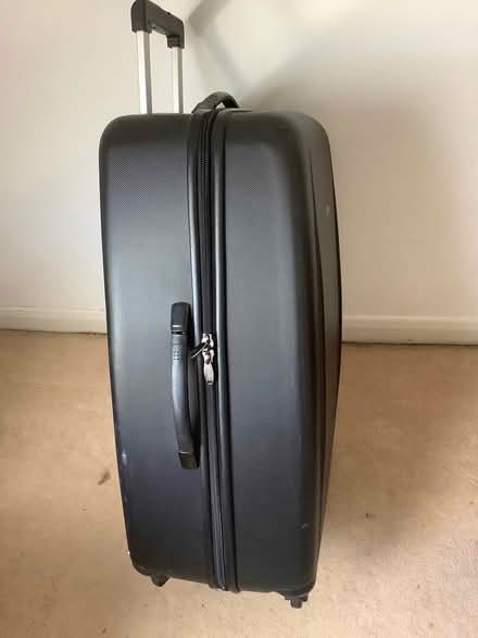 Photo of free Large suitcase on castors (Loughborough LE11) #1