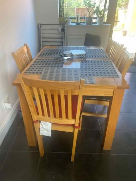 Photo of free Extendable dinning table and 6 chairs (Grays RM17) #1