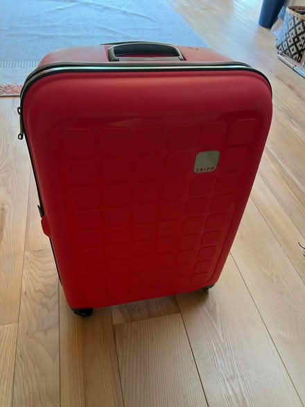 Photo of free Large Red Tripp suitcase (West Common AL5) #2
