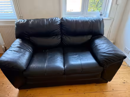 Photo of free Black leather sofa (Crowborough) #1