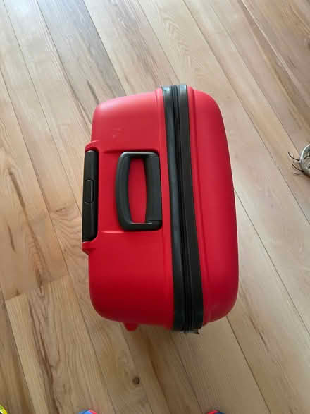 Photo of free Large Red Tripp suitcase (West Common AL5) #1