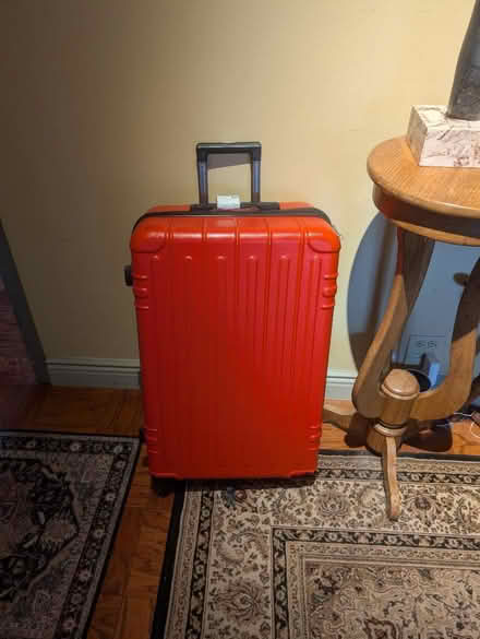 Photo of free Checked suitcase works 1 wheel gone (New York) #1