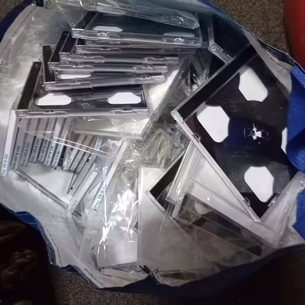 Photo of free Bag full of unused 2 CD hard cases (must be over a hundred) (Denton M34) #3