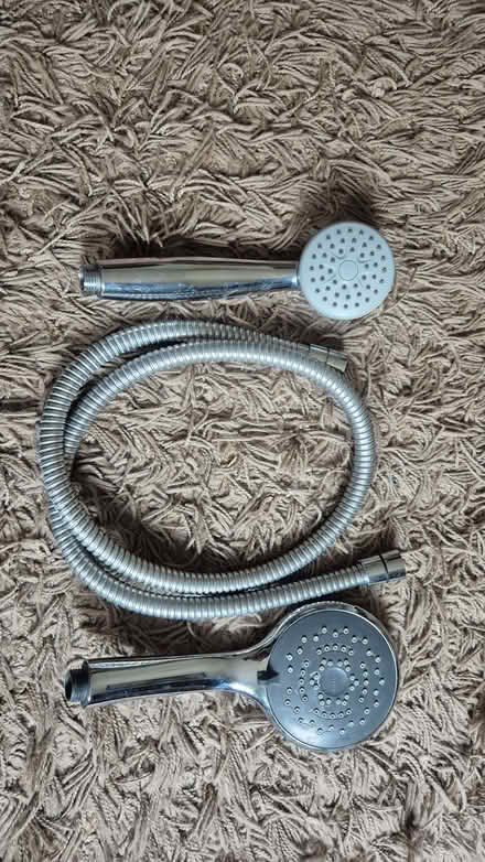 Photo of free Two showerheads and a hose (Norcot RG30) #1