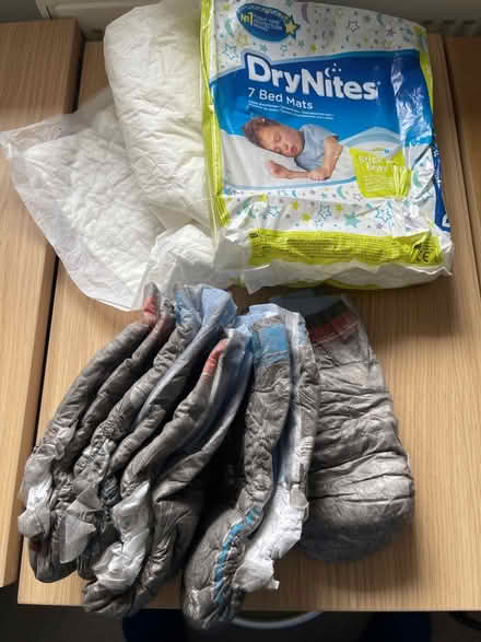 Photo of free Dry Nites nappies and bed sheets (Lightwater GU18) #1