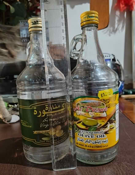 Photo of free 2 x 750ml glass demijohn bottle + cap (North Kensington W11) #1