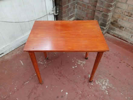 Photo of free Small wooden table on castors (LU1. Caddington) #1