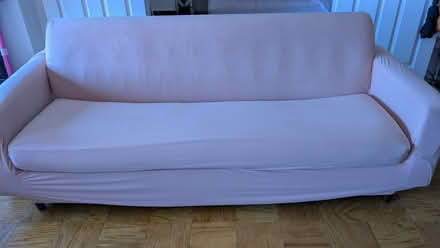 Photo of free Brown couch (with pink couch cover) (Rosslyn/Arlington, VA) #2