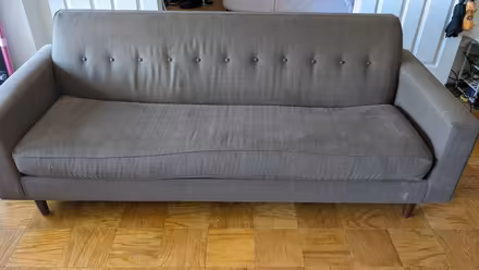 Photo of free Brown couch (with pink couch cover) (Rosslyn/Arlington, VA) #1