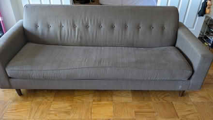 Photo of free Brown couch (with pink couch cover) (Rosslyn/Arlington, VA) #1