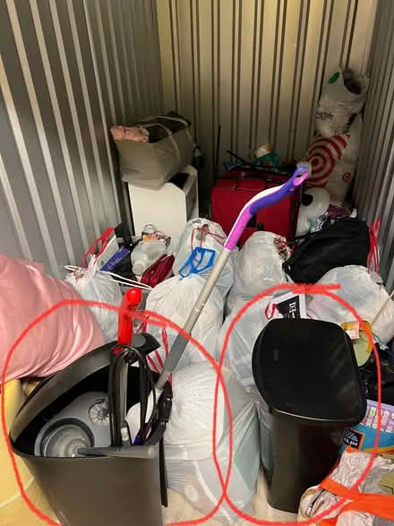 Photo of free 2 tall black kitchen trash cans (South Loop) #1