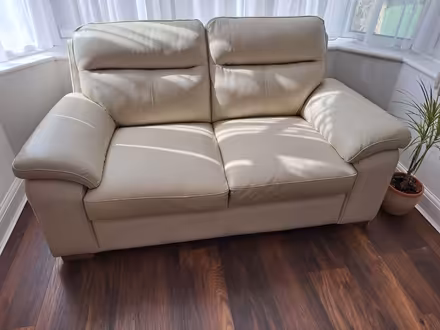 Photo of free Two cream leather sofas (Leatherhead) #1