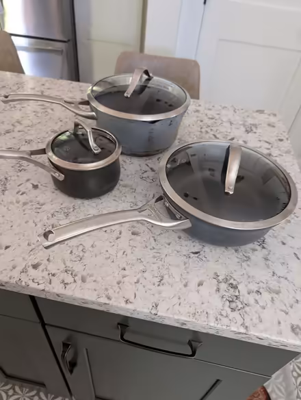 Photo of free Calphalon pots with lids (20910) #1