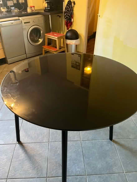 Photo of free Black Ikea table. Tubular metal frame, tempered glass top. (Druids Heath B14) #1