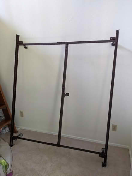 Photo of free Queen size metal bed frame w wheels (Seattle, WA) #1