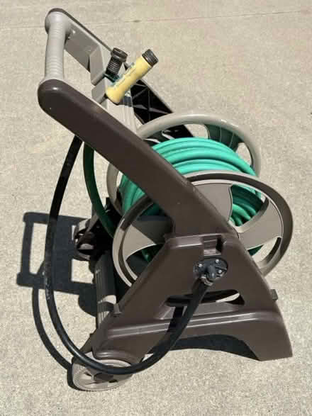 Photo of free Garden hose reel cart with hose (75th St NW and 75th Ave NW) #1