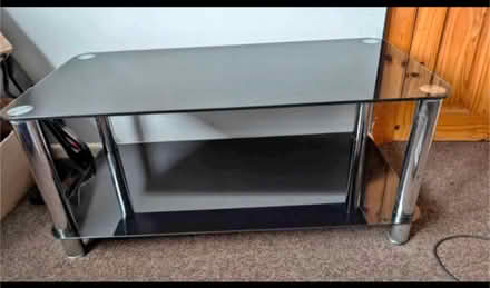 Photo of free Black glass TV stand (TR1) #1