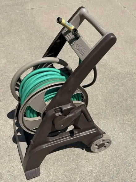 Photo of free Garden hose reel cart with hose (75th St NW and 75th Ave NW) #2