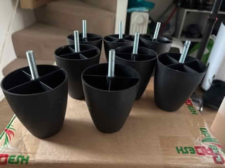 Photo of free 8 black plastic screw on feet (Limehouse E1) #1