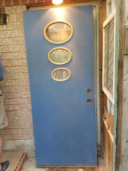 Photo of free Door, hollow, with 3 small windows (downtown Toronto west end) #1