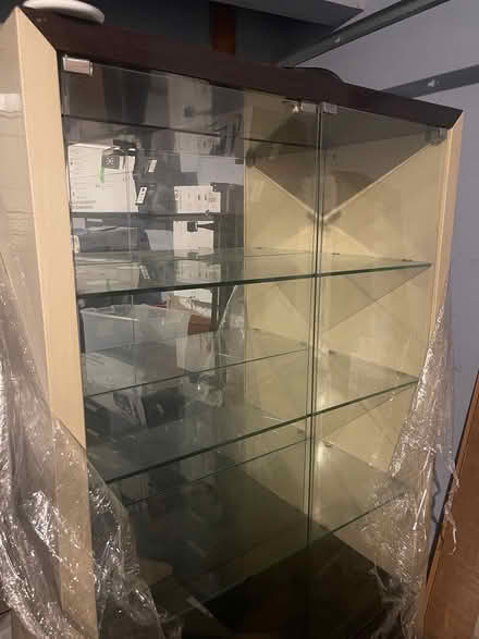 Photo of free Tall Glass cabinet (Romeoville,IL) #1