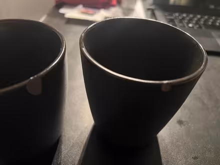Photo of free Black ceramic mugs, small chip (SE1) #2