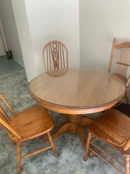Photo of free Wood dining table with 4 chairs (Near Angel of the Winds casino) #1
