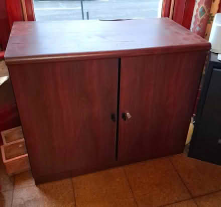 Photo of free Mahogany 2-door storage cabinet (Tufnell Park N19) #1