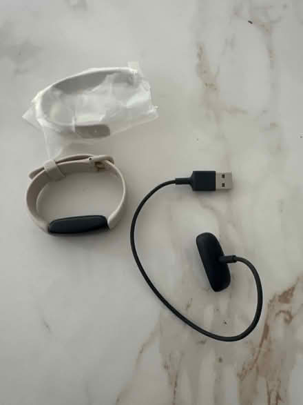 Photo of free Fit bit strap + charger (Ilkley LS29) #1
