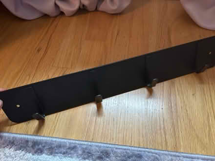 Photo of free Black metal 4 hook wall rack (McLean near Spring Hill Road) #1