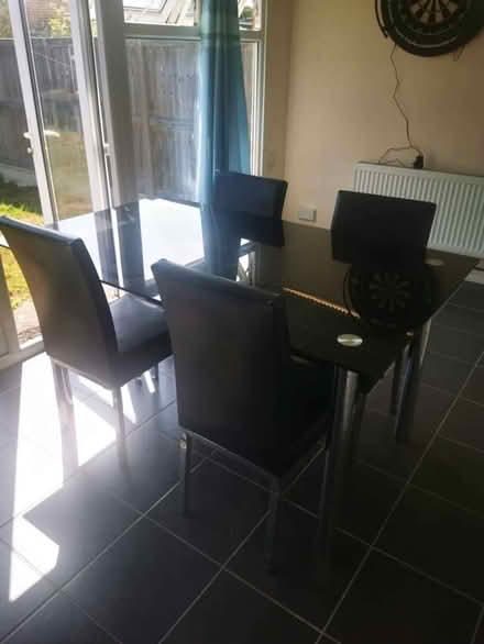 Photo of free Black glass dining table and 4x chairs (CT10) #1